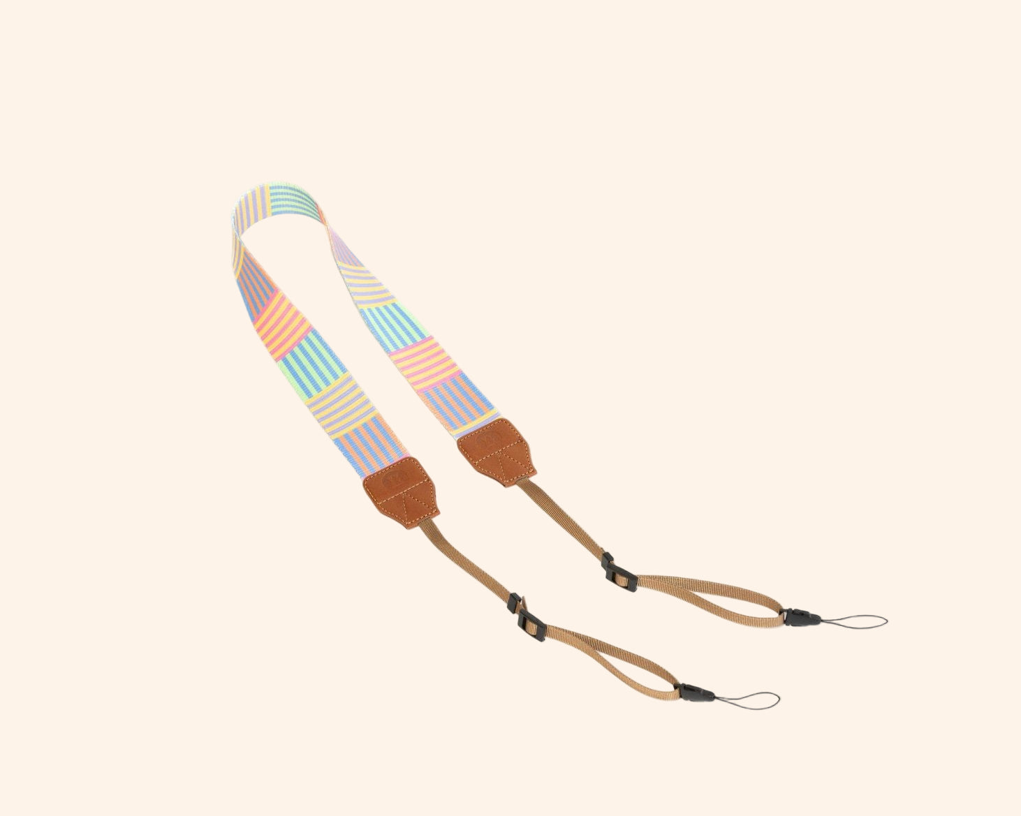 Colorful striped strap accessory for portable backgammon board with leather connectors and rope ends