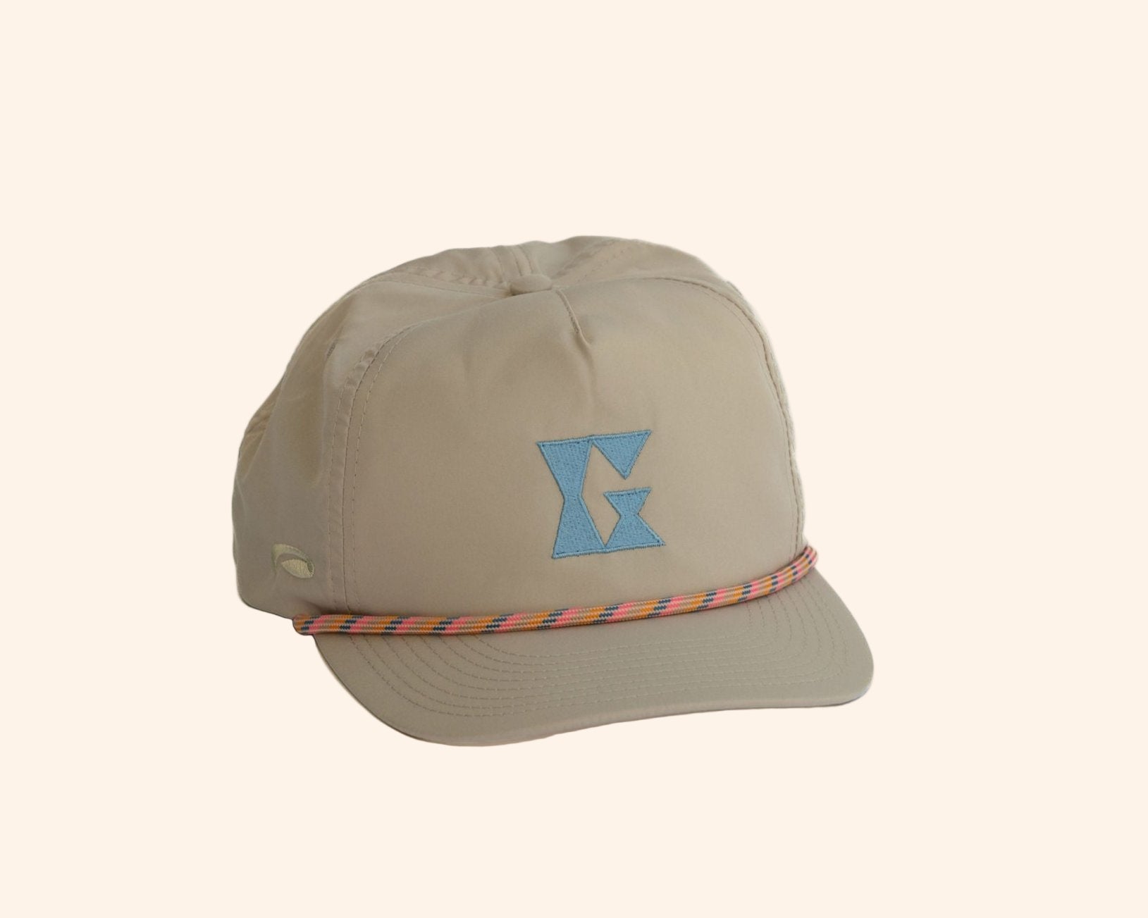 Beige 5-panel hat with Gammn logo and colorful rope trim on brim, on white background